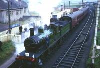 Ex-Great North of Scotland Railway 4-4-0 No 49 <I>Gordon Highlander</I> stands at Ponfeigh, Lanarkshire with a BLS railtour on 16 October 1965. View is north east towards Lanark, with the junction for the line to Douglas Colliery visible in the background. [See image 21104] <br><br>[Robin Barbour Collection (Courtesy Bruce McCartney) 16/10/1965]