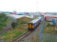 The Boat Train arrives at Heysham Port, formerly Heysham Harbour, to connect with the Isle of Man Steam Packet vessel <I>Ben-My-Chree</I>, seen in the background. 156480 will make two trips from Lancaster (2008 timetable) - this one arriving at 1230 to collect from the inbound sailing and then returning just before 1400 with outbound passengers for what will be a grey murky crossing. The slightly rusty line on the left is the connection into the two nuclear power stations but DRS flask traffic was light at that time as the stations were not operating at full capacity because of ongoing maintenance.<br><br>[Mark Bartlett 27/08/2008]