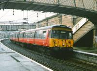 303 088, westbound with a Gourock service, calls at Greenock Central in July 1997.<br><br>[David Panton 15/07/1997]