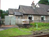 The small lever frame that operates the signals at Burneside crossing on the Windermere branch, outside the former crossing keepers cottage. <br><br>[Mark Bartlett 30/08/2008]