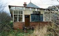 Creagan station emerges from the undergrowth. Subsequently the station building has been renovated. View looks north.<br><br>[Ewan Crawford //1990]