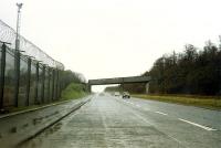 The road bridge which formerly crossed the A814 next to Faslane Port. The bridge carried the Military Port #1 Railway down from Shandon to the port.<br><br>[Ewan Crawford //1989]