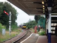 Walkden retains its signal box and semaphores. 150147 approaches from Atherton on a Southport to Rochdale service and the starter is off for a Kirkby service.  <br><br>[Mark Bartlett 01/09/2008]