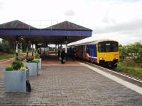 All the original L&Y stations on the direct 1888 Wigan (Crow Nest Junction) to Salford line have distinctive island platforms. Swinton, Atherton and Walkden also retain their impressive L&Y canopies. The waiting shelter under the canopy at Walkden looks superfluous but the station is on an embankment, the platforms are exposed and it keeps the wind out. <br><br>[Mark Bartlett 01/09/2008]