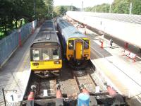 Morecambe and Millom services in Platforms 1 and 2 at Lancaster, bays on the down side of the station. 142093 is on the Morecambe run and 156454 is waiting to depart for Millom via Barrow in Furness.<br><br>[Mark Bartlett 01/09/2008]