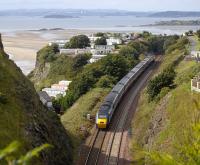 Having just left Kinghorn tunnel, the 09.50 Aberdeen - London Kings Cross NXEC service passes Pettycur Bay.  A steeply graded branch once dropped to the shore at the left of the train to serve a bottle works. The Forth Bridge stands in the left background.<br>
 <br>
<br><br>[Bill Roberton 03/09/2008]