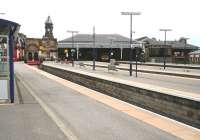 Looking back from a short distance along platform 1 towards the buffer stops at Scarborough on 3 April 2008. The clock tower stands above the main station buildings on Westborough Road in the left background, with trainsheds past and present running off to the right. Nowadays the external bay platforms 1 and 2, nearest the camera, supplement the stations main operational platforms 3, 4 and 5 contained within the remaining trainshed. Standing at platform 4 within the trainshed on this particular morning is a First TransPennine 185 DMU service ready to depart for York, Manchester Piccadilly and Liverpool Lime Street. <br><br>[John Furnevel 03/04/2008]