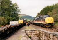 In the early 1990s at midday the northbound Mossend Yard - Mallaig Junction Yard crossed its southbound equivalent at Tyndrum Upper, or sometimes Crianlarich or Bridge of Orchy. The drivers swapped over. Back then the line also had enough traffic for nightly freights. View looks north.<br><br>[Ewan Crawford //1990]