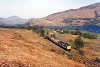 Southbound freight by Loch Lomond in 1990.<br><br>[Ewan Crawford //1990]