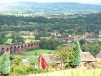 Panoramic view of the 48 arch viaduct from Whalley Nab (Map ref SD 728354) as 156473, heading for Clitheroe, crosses the swollen River Calder on the approach to Whalley station at the far end of the bridge. <br><br>[Mark Bartlett 06/09/2008]