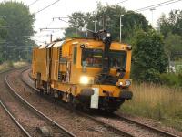 Network Rail stoneblower DR80303 at Johnstone station heading west on 5th September 2008<br><br>[Graham Morgan 05/09/2008]