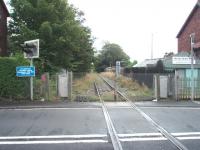 The view across Station Rd Crossing towards Poulton-le-Fylde from the end of Thornton Up platform on the former double track Fleetwood branch, closed to passengers in 1970 with the last freight running in the 1990s. There are now early plans for reopening but a lot of work to do. Map Ref SD 344421<br><br>[Mark Bartlett 09/09/2008]