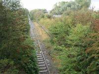 Closed station on a mothballed railway. Burn Naze lies entirely inside a secure industrial estate. It opened late, in 1908, closing with the line in 1970 and the two platforms are now very overgrown. View towards Fleetwood taken with permission of Hillhouse Estates staff. Map Ref SD340439   <br><br>[Mark Bartlett 09/09/2008]