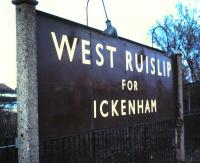 A grandiose run-in board for a suburban station, photographed in March 1985. The station was opened by the Great Western & Great Central Joint Railway in 1906 as Ruislip & Ickenham, changed to the name shown here in 1947 and, in the latter days of British Rail, was changed once again, this time to plain West Ruislip. <br><br>[David Panton 01/03/1985]