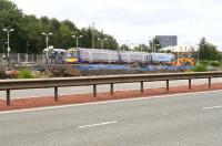 View of Uphall station from the verge above the underpass on the north side of the M8 as a Waverley - Bathgate service arrives on 11 September 2008, alongside ongoing work on the new platform.<br><br>[John Furnevel 11/09/2008]