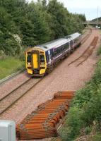 A Waverley - Bathgate train approaching Livingston North on 11 September passes one of the remaining gaps on what is scheduled to become the new westbound line with effect from next month.<br><br>[John Furnevel 11/09/2008]