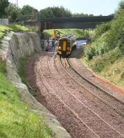 An eastbound 158 leaving the platform at Livingston North on 11 September with the 1255 Bathgate - Newcraighall <I>Crossrail</I> service. Note the major works that have been required in connection with the widening and strengthening of the cutting at this point.<br><br>[John Furnevel 11/09/2008]