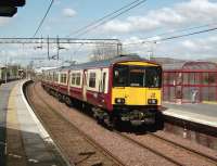 Sunshine on Yoker on 19 April 2008 as 318 256 arrives with a service to Motherwell.<br><br>[David Panton 19/04/2008]