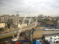 View southeast showing progress on the East London Line northern extension at Shoreditch on 15 September 2008. After crossing Shoreditch High Street on the new bridge, the line swings north over New Inn Yard to join the former route from Broad Street. [The old tube stock seen bottom right is standing on the Broad Street trackbed on the south side of Holywell Lane.] From here it will continue along what is mainly existing urban viaduct as far as Western Junction on the North London Line, from where it will run west to a terminus at Highbury and Islington. [Interchange will be available there with the Victoria Line, Northern City Line and North London Line.] <br><br>[Michael Gibb 15/09/2008]