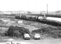 A southbound express freight, double headed by 31295+37171 on the northern approach to York station at Skelton Junction on 21 July 1980.<br><br>[John Furnevel 21/07/1980]