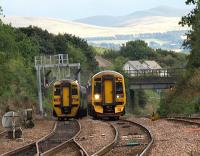 Two class 158 sets pass on the southern approach to the Forth Bridge between Dalmeny North Junction and Dalmeny station. On the left is an ECS move to Waverley, with the set on the right  1717 Edinburgh to Perth.<br><br>[Brian Forbes 11/09/2008]