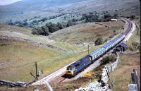 A class 47/3 about to enter the north end of Blea Moor Tunnel with a train on the Settle & Carlisle Line in 1984 with Dent Head in the background.<br><br>[Colin Alexander //1984]