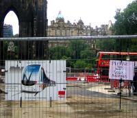 Looking down South St David Street towards Princes Street on 20 September 2008. The cordoned off area, behind which tram works are now well underway, has one official notice displayed alongside an unofficial addition courtesy of a passing eejit. [The official notice reads <I>'Catch the first tram 2011'.</I>] <br><br>[John Furnevel 20/09/2008]