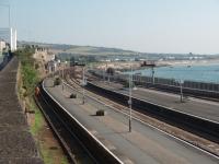 The view eastwards from Penzance through the station approach to where the single line section runs along the sea wall towards Long Rock passing Ponsandane servicing depot in the distance. The station is still controlled by the signal box that sits against the rock face on the left hand side. <br><br>[Mark Bartlett 18/09/2008]