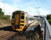 A 4-car 158, headed by an Alphaline set, on a returning inner circle service, calls at Dunfermline Queen Margaret on 20 September.<br><br>[David Panton 20/09/2008]