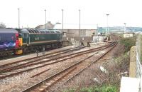 57603 <I>Tintagel Castle</I> stands with <I>Night Riviera</I> sleeper stock at the eastern end of the Ponsandane carriage sidings overlooking the Long Rock level crossing. The single track main line becomes double just round the bend in this view eastwards to Marazion and St. Erth. <br><br>[Mark Bartlett 16/09/2008]