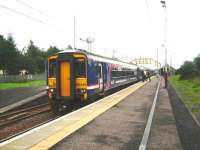 A 4-car 156 with an Edinburgh - Glasgow Central service, picks up passengers on 17 September at Holytown.<br><br>[David Panton 17/09/2008]