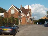 Bosham forecourt and original station building. Locals assure me the name is pronounced <I>Bozzam</I>. The station lies east of Chichester on the line to Portsmouth and Southampton and enjoys a healthy level of train services.<br><br>[Mark Bartlett 13/09/2008]