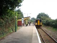 Penmere Platform was a late opening in 1925 serving a suburb of Falmouth. It is well maintained and the replica signs add to the atmosphere. 153382 leads a Truro service. <br><br>[Mark Bartlett 16/09/2008]