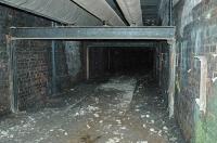 Before work started to re-instate the Maryhill-Anniesland line it was still possible to look through the gate down the old tunnel between Dawsholm and Temple Gasworks. This low tunnel carried a private railway and passed under the Forth and Clyde Canal. Surprisingly the track was still in place at the Dawsholm end.<br><br>[Ewan Crawford 01/05/2004]