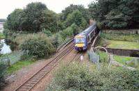 A westbound train shortly after leaving Grahamston on 23 September 2008 crossing the Forth and Clyde Canal at Swing Bridge East, photographed from alongside the A9. [See image 17992] <br><br>[John Furnevel 23/09/2008]