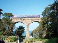 Almost perfectly framed, 153361 crosses the viaduct overlooking the stunning Carbis Bay before caling at the station on another run from St Ives down to the mainline junction at St Erth. <br><br>[Mark Bartlett 18/09/2008]