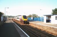 Cross Country Voyager 220029 heads east through Hayle, now an unstaffed halt. From the platforms there is a view across the Hayle estuary to the two Lelant halts on the St Ives branch whilst behind the blue railings is the trackbed for the former Hayle Wharf branch. <br><br>[Mark Bartlett 18/09/2008]