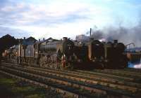 End of day scene at Carlisle Kingmoor shed in the 1960s featuring Black 5 44722 and BR Standard class 6 no 72007 <I>Clan Mackintosh</I> amongst the locomotives on shed.<br><br>[Robin Barbour Collection (Courtesy Bruce McCartney) //]