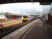 View towards Lostock and Bolton as a Manchester service departs from Horwich Parkway with 150150 coupled behind a 156 unit.<br><br>[Mark Bartlett 02/10/2008]