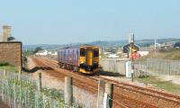 150246, heading for Plymouth, leaves the single line section from Penzance and passes the site of Marazion station. The former station building, closed in 1964, can be seen on the down side in this view towards Penzance.<br><br>[Mark Bartlett 18/09/2008]