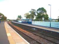 View towards Derby at Uttoxeter showing the basic facilities but a rather large waiting shelter. This may be intended for racegoers traffic as the horse racing course is just behind the Stoke platform. Trains towards Stoke are still controlled by a bracket semaphore signal just behind the photographer. <br><br>[Mark Bartlett 03/10/2008]