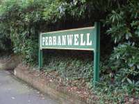 Traditional <I>running in</I> board at Perranwell at the Truro end of the surviving platform. It is mounted between two old rails and although this is a fairly basic halt the old sign adds character to the Falmouth Branch station. <br><br>[Mark Bartlett 19/09/2008]