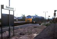 Scene at Selhurst in 1976 as 1051 <I>Western Ambassador</I> passes with a return stores empty working heading for Acton.<br><br>[Ian Dinmore //1976]