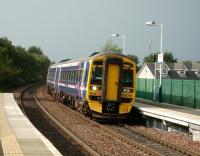 Refurbished set 158 718 (note the halogen headlights) arrives at Camelon on 27 September 2008 bound for Edinburgh Waverley.<br><br>[David Panton 27/09/2008]