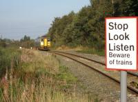 A southbound 153 332 climbs up from the WCML at Farington Curve Junction with a Preston to Ormskirk service on 27 September 2008. The original L&Y line ran to the right of the train and accessed Preston and the East Lancs via Lostock Hall and Todd Lane Junction.<br>
<br><br>[John McIntyre 27/09/2008]