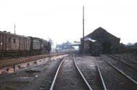 Scene at Beattock in the 1960s. A banker simmers outside the shed between duties as a Britannia Pacific heads south towards the station with a freight. <br><br>[Robin Barbour collection (Courtesy Bruce McCartney) //]