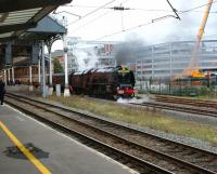 Ex-LMS Pacific 6233 <I>Duchess of Sutherland</I> calls at Preston platform 6 on the return Carlisle - Crewe leg of <I>The Royal Scot</I> special on 9 October. The special was diesel hauled both ways on the Crewe - London Euston legs. Meantime work on the new multi storey car park on the old East Lancs side of the station continues apace.   <br><br>[John McIntyre 09/10/2008]