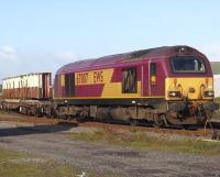 EWS 67007 stands in Millburn Yard, Inverness, with sections of the former Merry Street Bridge destined for the Strathspey Railway.<br><br>[Mick Golightly //]