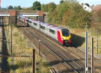 View north towards Preston over the site of Farington station on 28 September with a pair of Voyagers heading for Birmingham. The bridge in the background carries the route from Farington Curve Junction to Lostock Hall and the East Lancs lines.<br><br>[John McIntyre 28/09/2008]