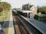 Bosham sees 377422 call on an evening, westbound south coast service. View from the footbridge, which is adjacent to a level crossing, towards Chichester. <br><br>[Mark Bartlett 13/09/2008]